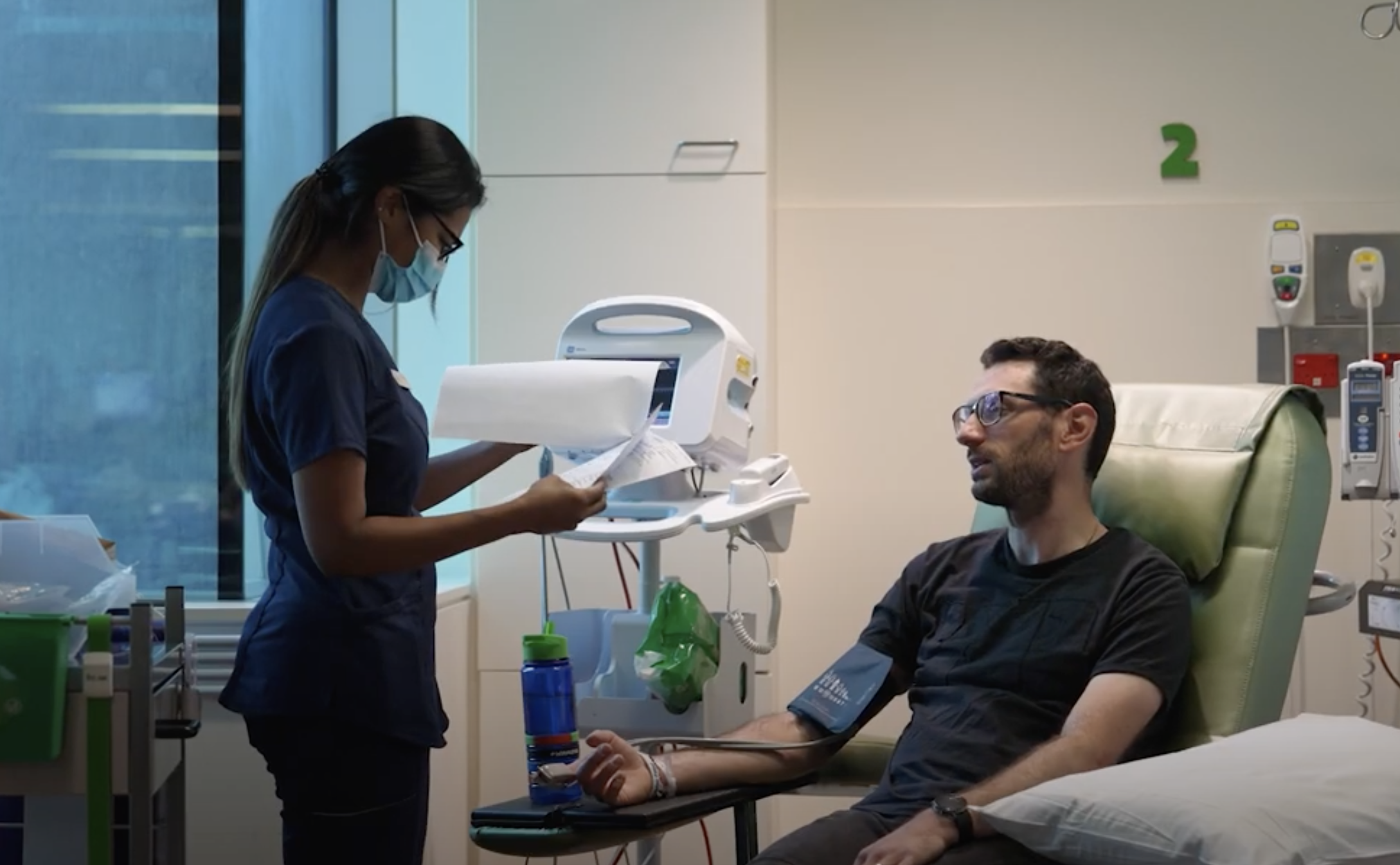 Adriano gets his blood pressure checked by a nurse.