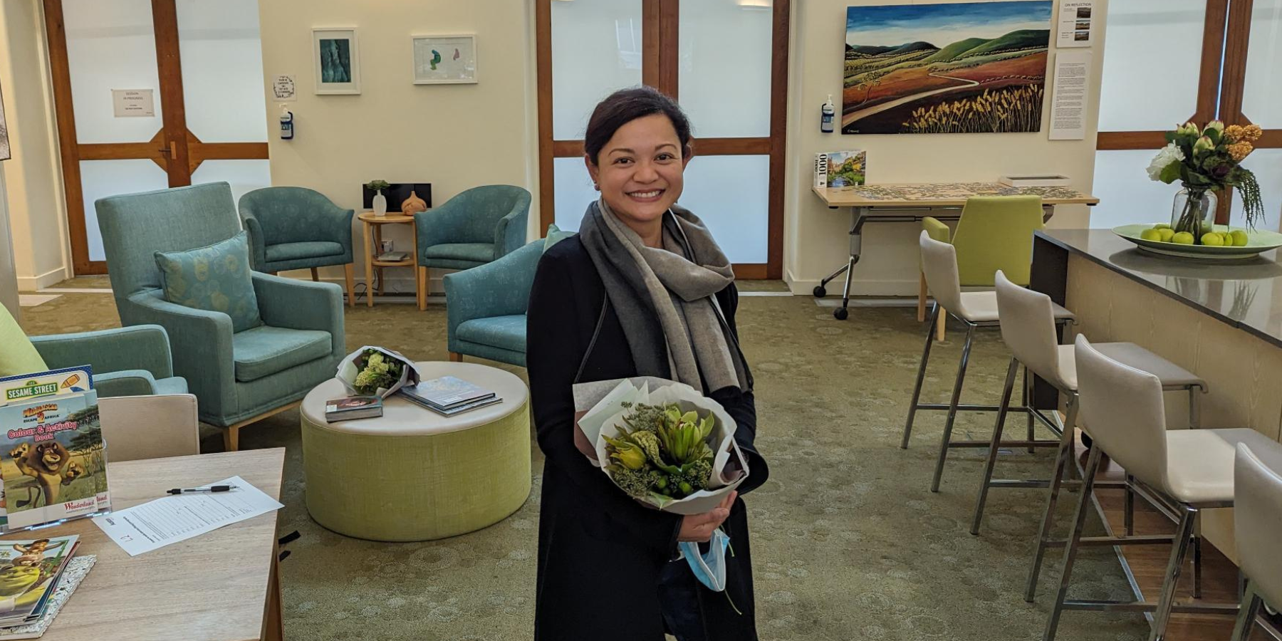 picture of a woman holding a bouquet of flowers