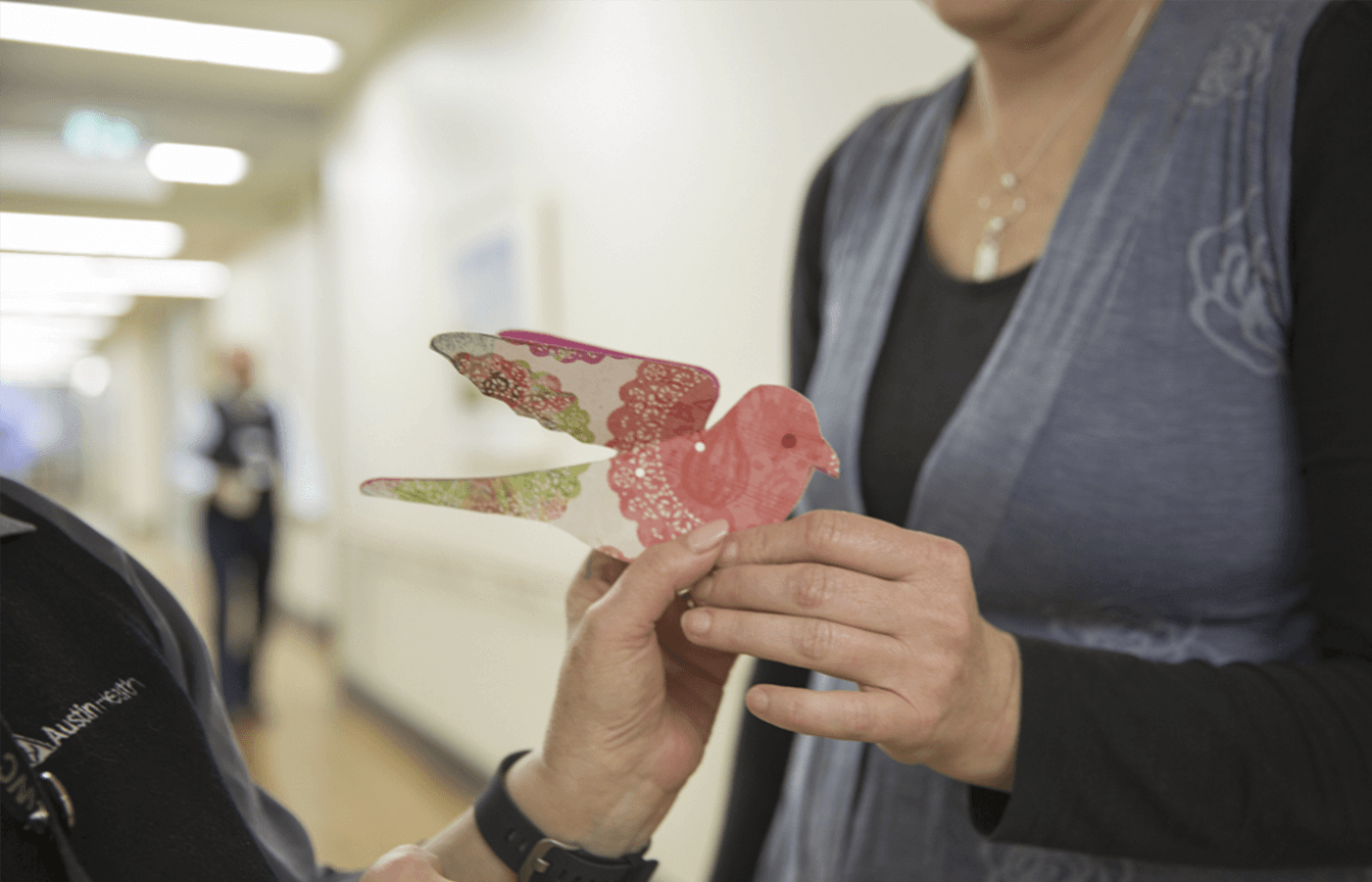 handsholdingpaperbird